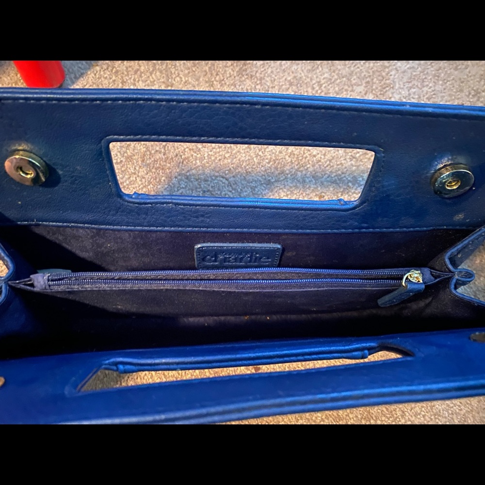 Dark blue Charming Charlie Clutch purse.